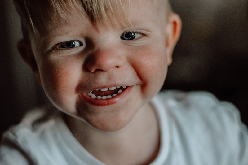 photography courses online toddler boy with blond hair close up smiling