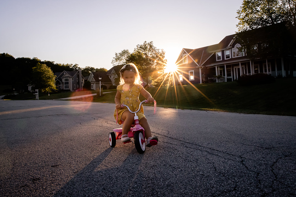 natural light photography tips when shooting little girl on bike