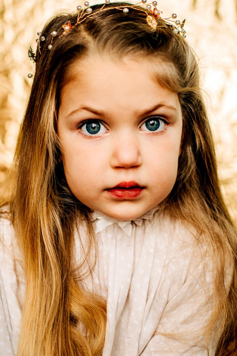 learn how to take studio portraits of little blond girl 