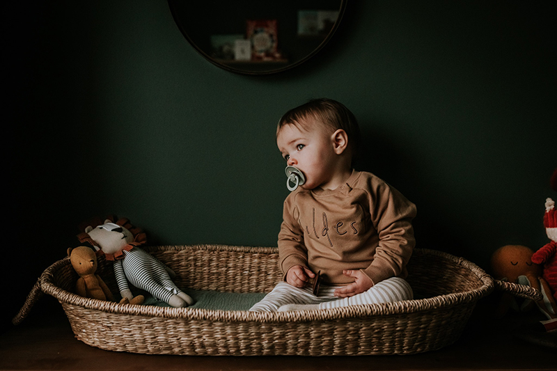 portrait of baby boy in bassinet