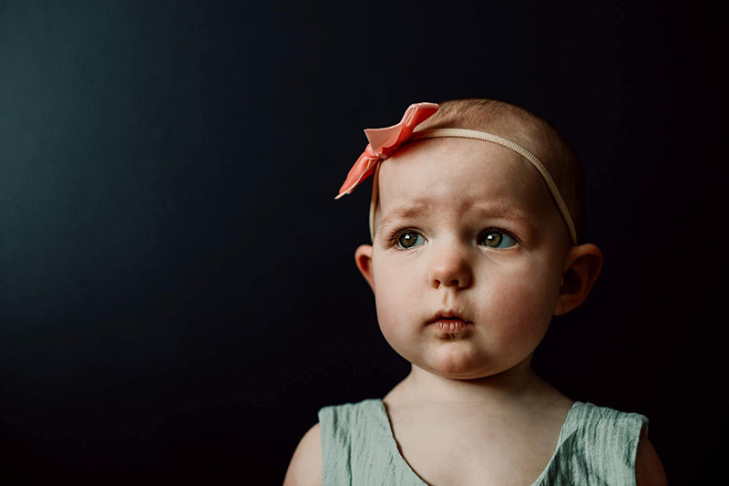 studio portrait of baby girl