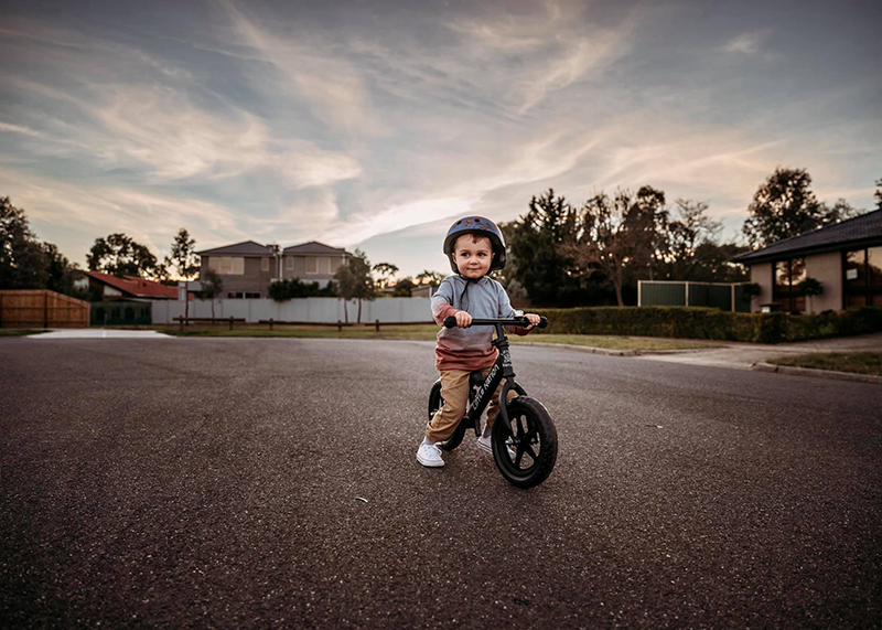 toddler on a bike with a bike helmet