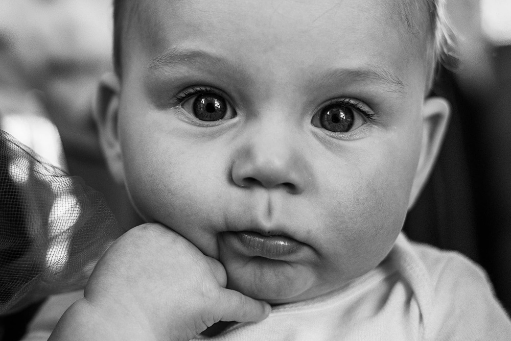 close up black and white portrait of baby