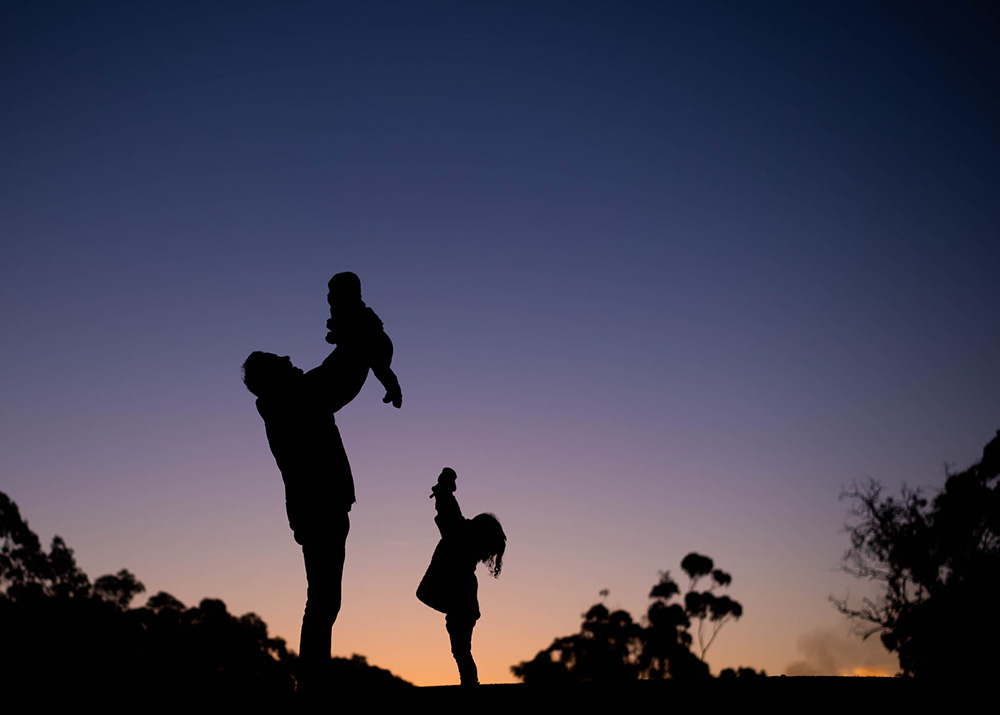 silhouette against purple sky