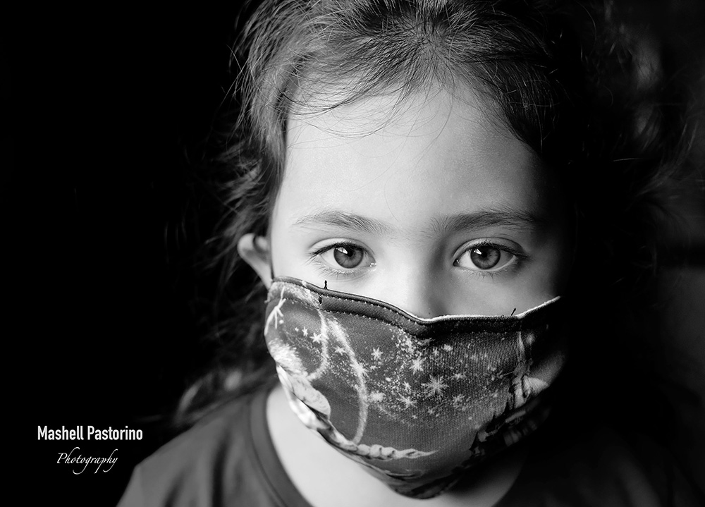 black and white portrait of girl in mask