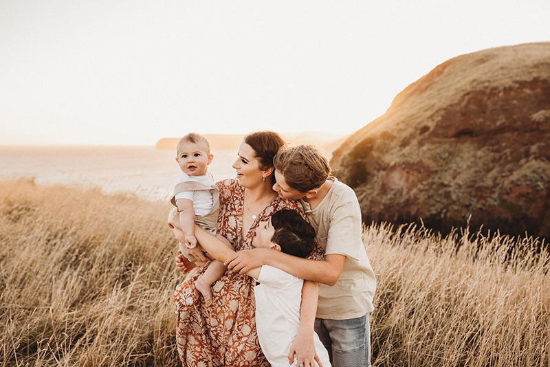portrait of young family at golden hour