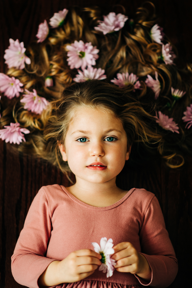 portrait of young girl with flowers in her hair