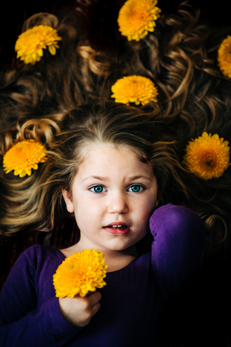 portrait of young girl with flowers in her hair