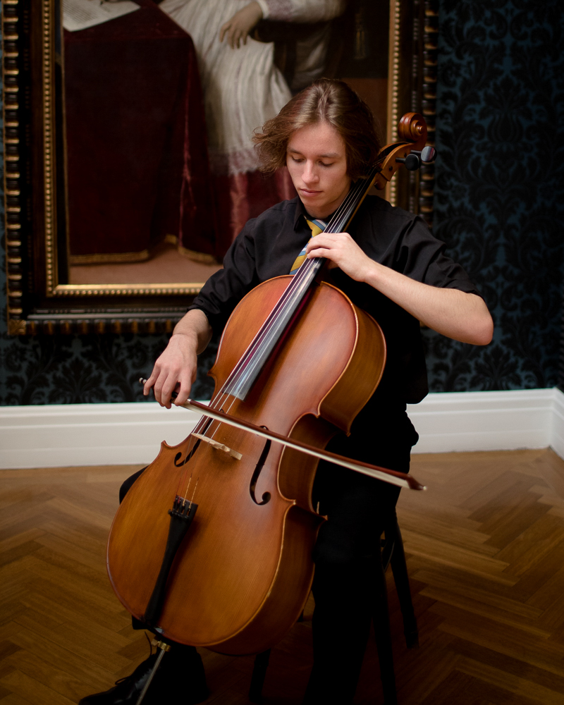 portrait of senior boy playing cello