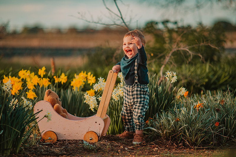 happy toddler in the garden smiling 