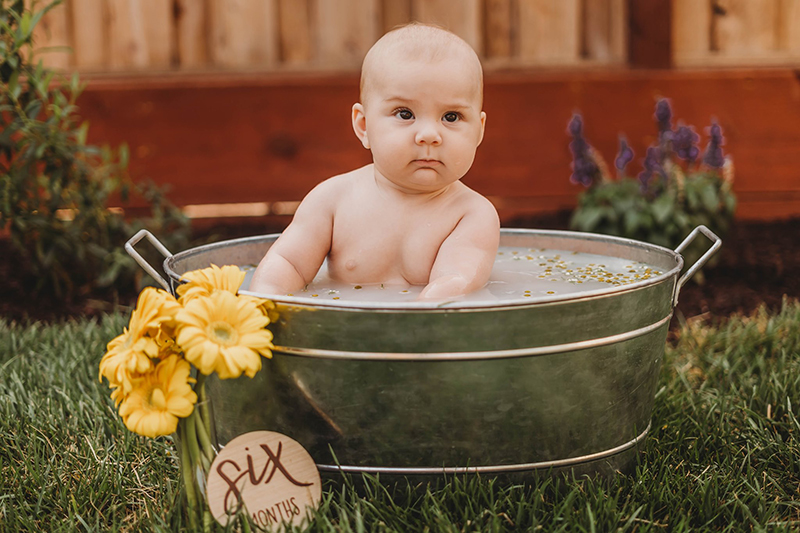 baby milestone photos baby in a bath