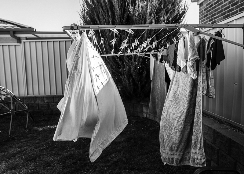 black and white image of washing on the line