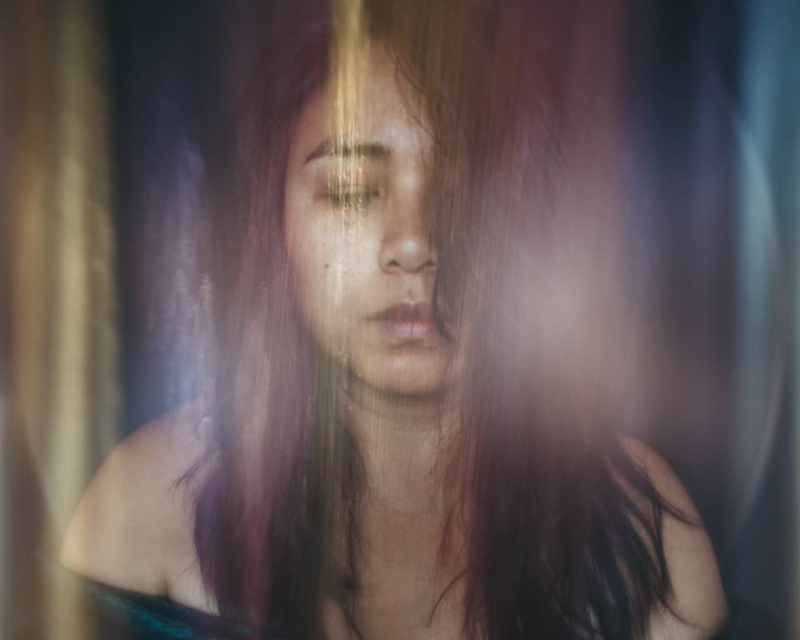 self portrait of woman with coloured haze