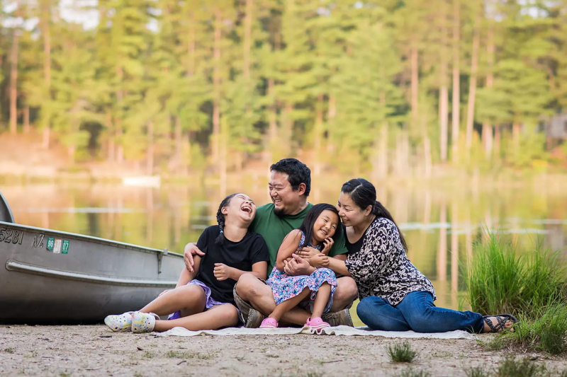 family portrait of Asian family outdoors
