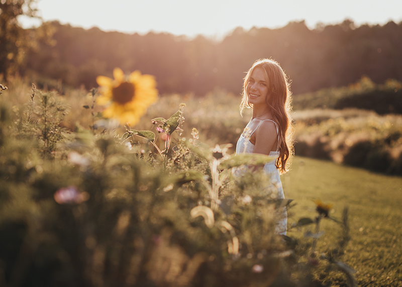 girl in field of sunflowers