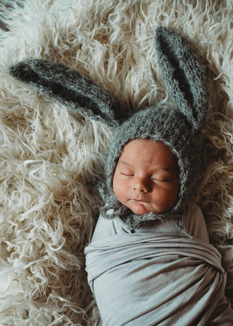 Newborn baby wearing bunny ears