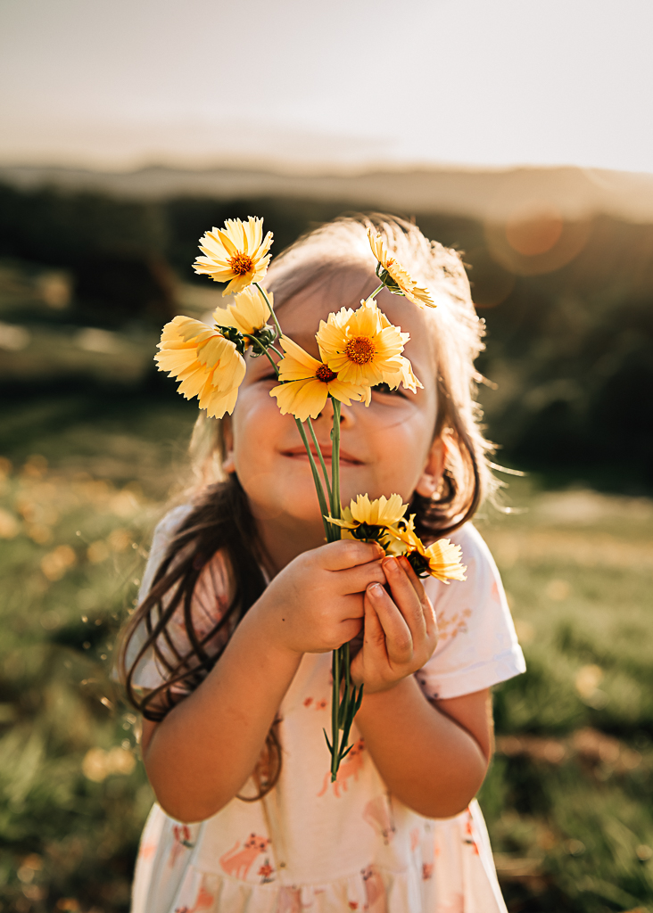 smiling child in photo with tulips