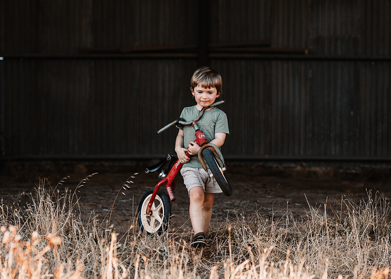 kids photo boy with red bike