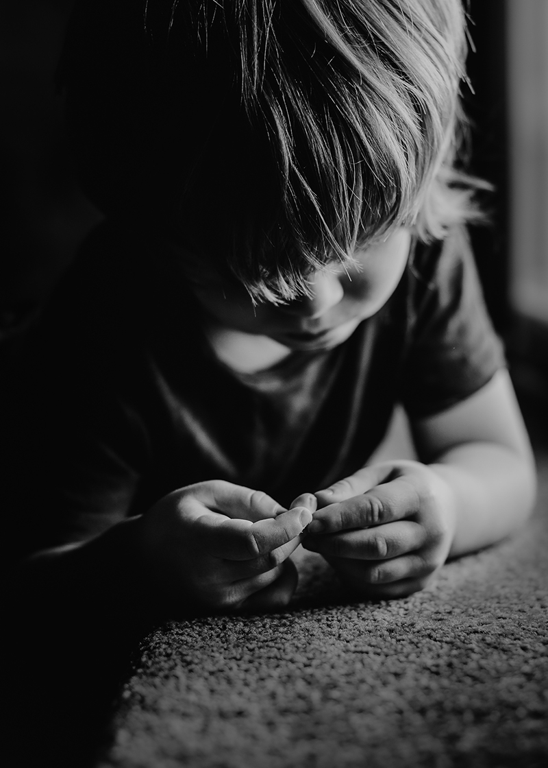 B&W portrait boy close up dramatic light
