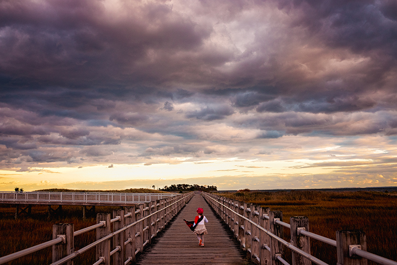 kids portraits girl negative space sunset sky clouds leading lines