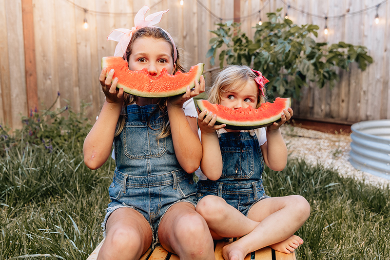 girls watermelon kids portrait summer golden hour