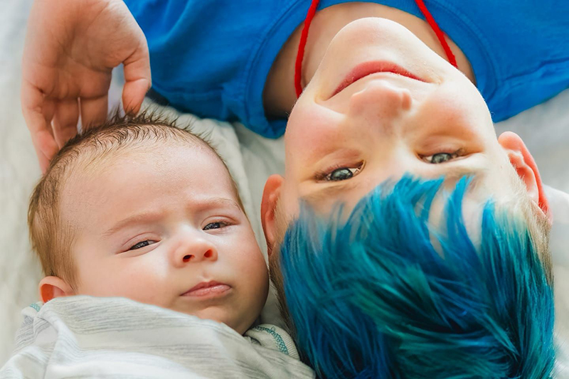 baby & sibling photo blue hair critiquing